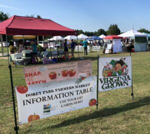 Farms market stands with signage displaying Virginia Grown