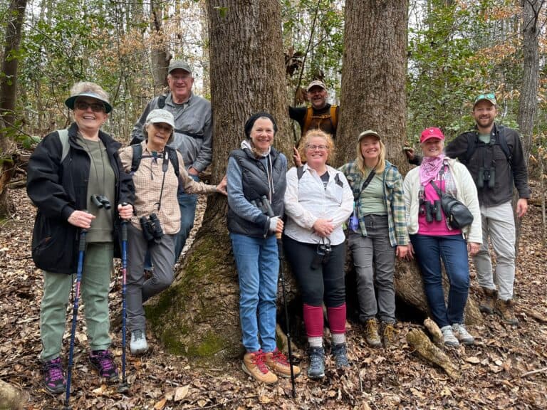 Group of hikers smile for the camera