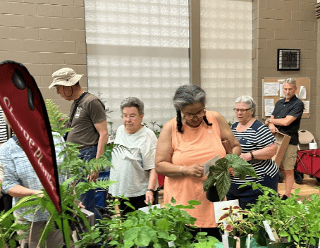 Attendees peruse native plants at Henrico Master Gardener Pollinator Festival