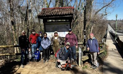 Volunteers gather in front of trailhead on James River Park System